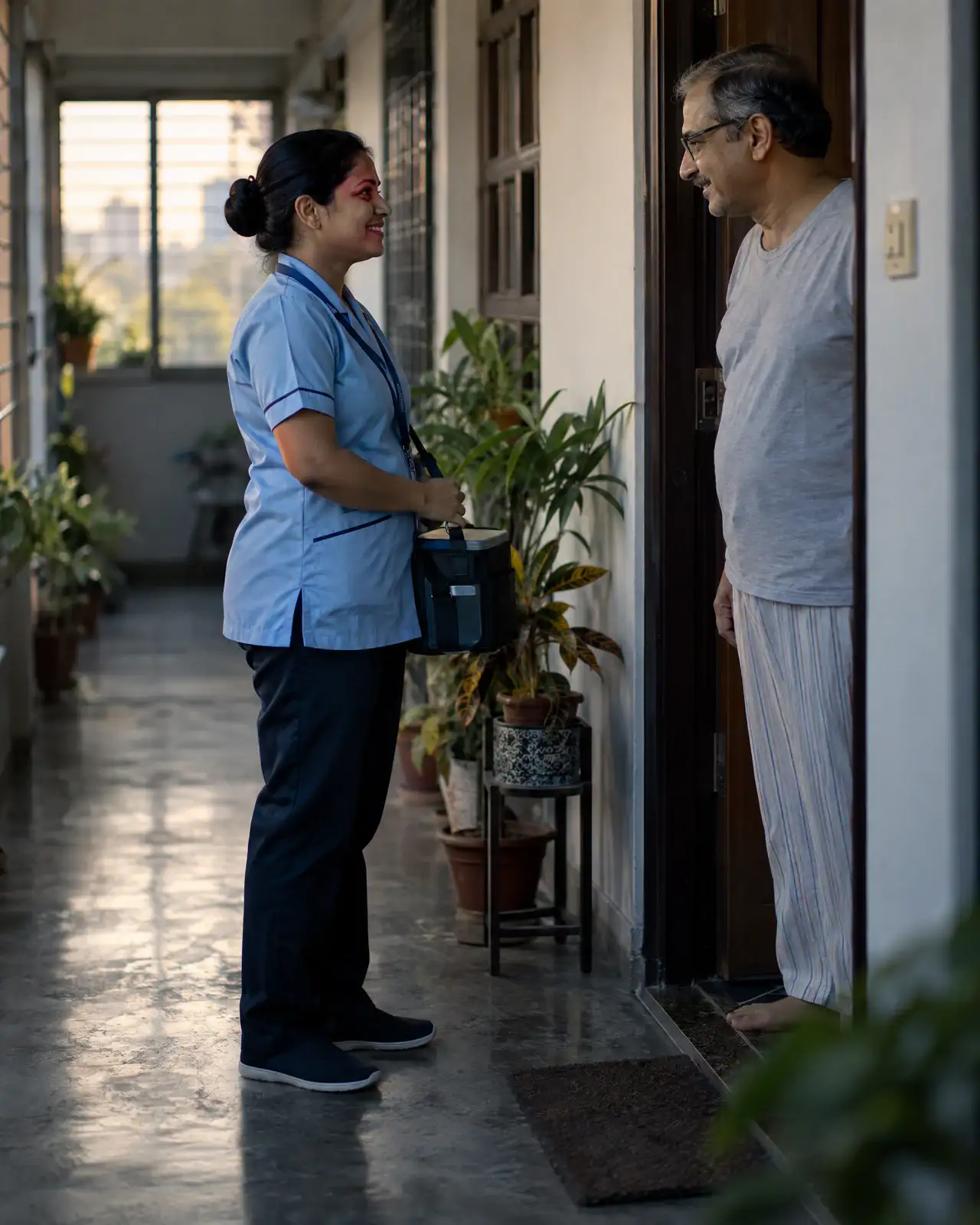 A sample collector with her kit, greeted at an apartment door in early morning light.
